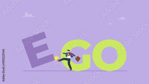 Businessman kick an E to change EGO to GO text. Business success, challenge, motivation, achievement and goal concept.