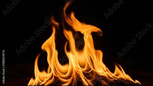Fiery Flames Dancing Against a Dark Background, Burning Brightly, Orange and Yellow.
