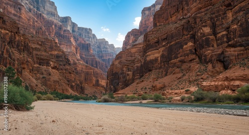 Rugged canyon with river and dry sandy riverbed including copy space