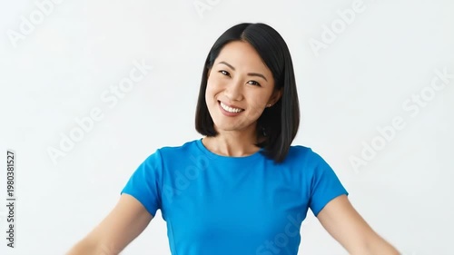 Happy Asian Woman Showing Strength and Confidence Posing on White Background.