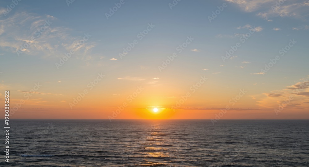 Obraz premium Morning ocean view with rising sun and gentle white clouds in sky