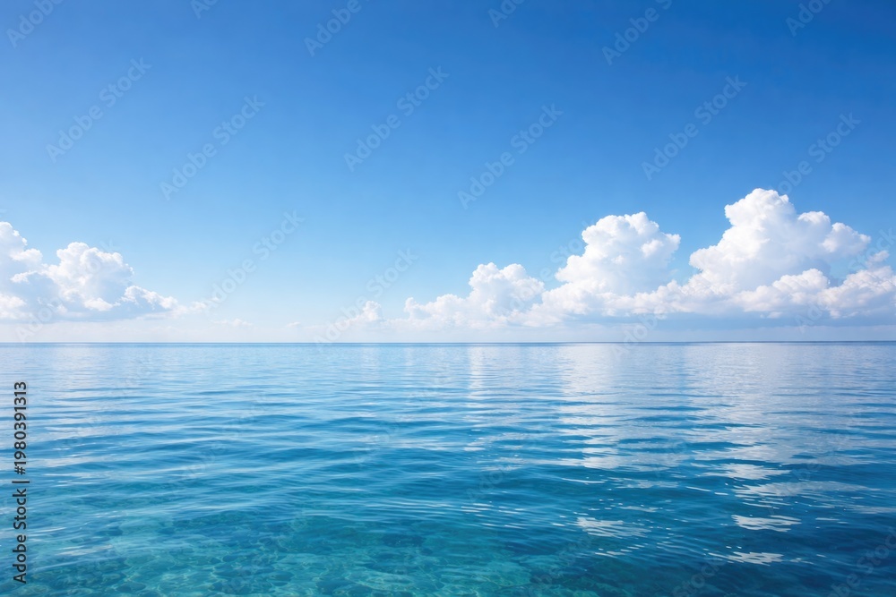 Obraz premium Calm Ocean Water Reflecting Clear Sky and Clouds