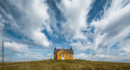 Yellow cottage elevated wit...