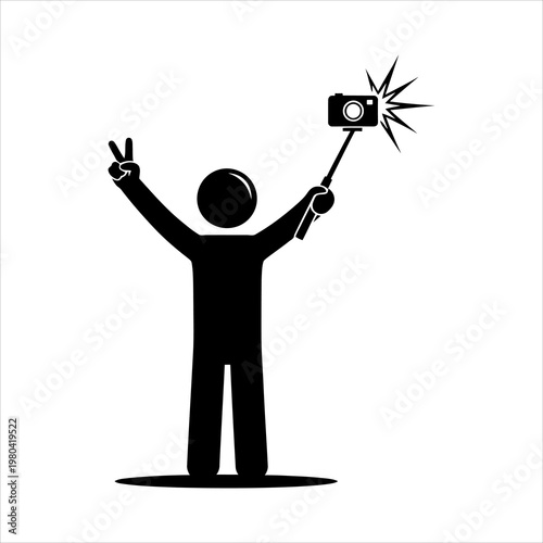 Person taking a selfie with a camera on a stick and peace sign