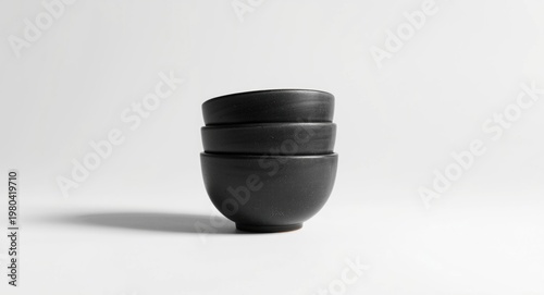 stacked black ceramic bowls...
