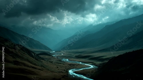 Serene river winding through misty mountain valley