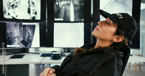 Vászonkép Sleeping, security and tired woman in control room with fatigue, narcolepsy or slacker