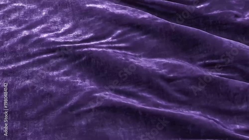 Close-up of luxurious textured purple velvet fabric with soft folds and subtle sheen, moody lighting
