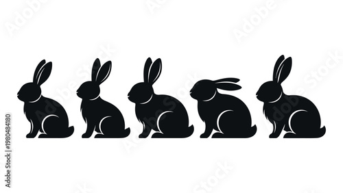 A row of five black silhouettes depicting rabbits in various seated poses