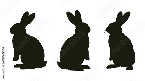 Three black silhouettes of rabbits are depicted in varying poses