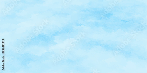 A beautiful clear blue sky with fluffy white clouds on a bright sunny day creates a peaceful summer atmosphere in this heavenly nature cloudscape