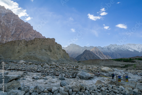 Jagged peaks of the Karakoram pierce the sky, carved by time and wind. Silent, fierce, and breathtaking, they stand as raw poetry of nature where clouds drift low and the earth feels untamed.