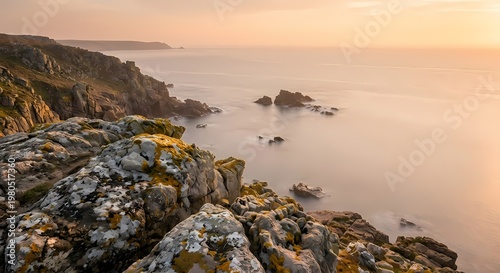 The calm sea extends to the horizon dotted with scattered rock formations. 
