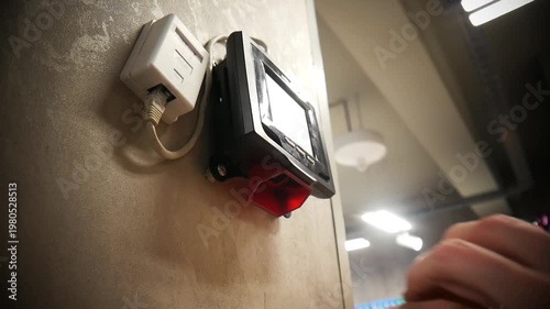 A man scans a product using a price checker