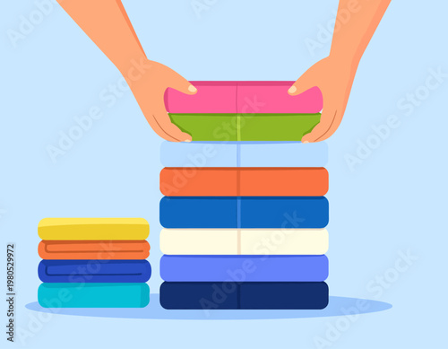 Hands stacking a pile of colorful folded clothes or fabrics. Organization, laundry, and domestic chore concept. Flat vector illustration.