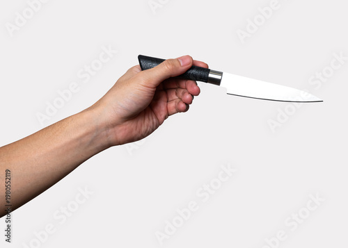 Male hand holding a steel cooking knife isolated on white background with clipping path.	
