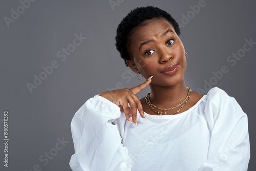 Obraz na płótnie Portrait, thinking and black woman with pride in studio for vision, planning and sarcasm expression