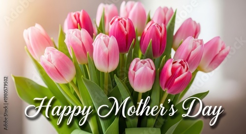 Pink and white tulips bouquet with happy mother's day greeting on soft blurred background, flowers