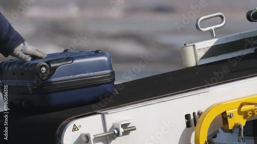 Airplane suitcases luggage baggage conveyor worker at airport terminal airline aircraft. Passengers boarding airplane.
