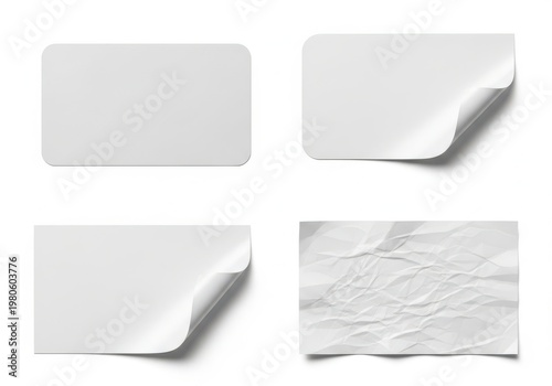 A set of four blank white sticky notes with different corners and textures on a plain background