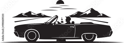 Black silhouette of a convertible car driving towards mountains at sunset