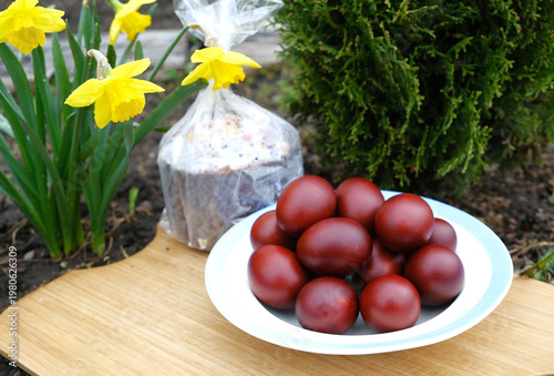 Easter eggs and Easter cake with flowers