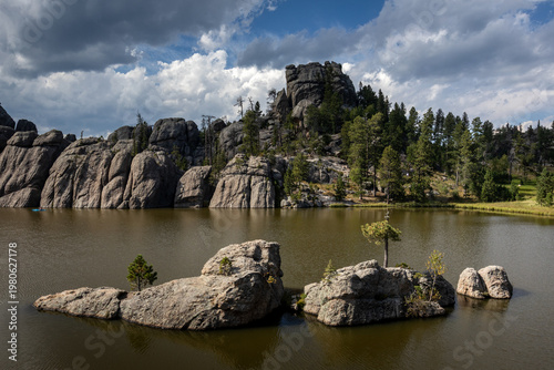 Tranquil Mountain Lake With Rocky Shoreline, Pine Forest and Ref
