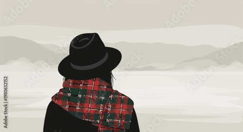 Person in hat and plaid scarf gazes at muted mountain landscape