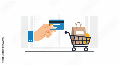 Hand holding credit card near shopping cart with purchases