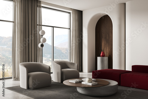 Modern interior living room with soft armchairs, large windows, mountain view, round table, elegant curtains, arched niche and minimalist decor. 3D Rendering