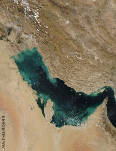 Tableau sur toile Clouds of tan, blue, and green swirl fancifully along the shores of the Persian