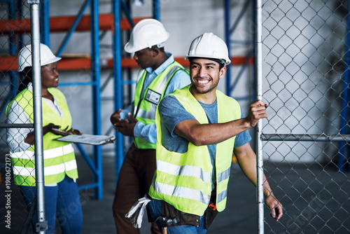 Φωτογραφία Preparation, smile or people on construction site with fence, shift setup or activation in morning