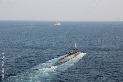 STRAIT OF HORMUZ U.S. Navy and Coast Guard ships participates in a photo exercise while transiting the Strait of Hormuz,  Sioux City is deployed to the U.S. 5th Fleet area of operations to help ensure