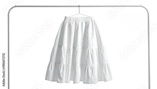 Smock skirt with voluminous tiers hanging on a metal rack in a bright studio featuring puckered seersucker texture and volume generative AI