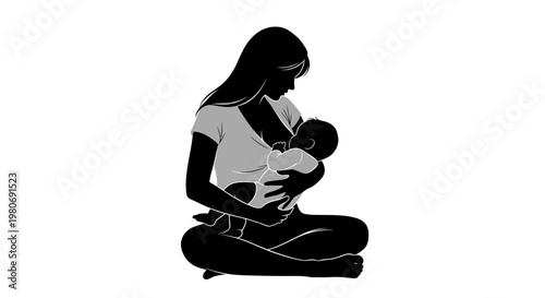 Silhouette of a mother breastfeeding her newborn baby.