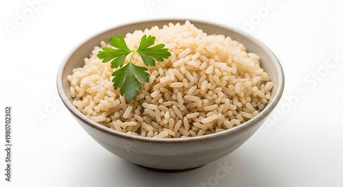 Brown rice in a bowl with parsley garnish