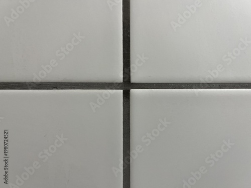 Obraz na plátně Perfect geometric cross intersection of clean white ceramic tiles with dark grey
