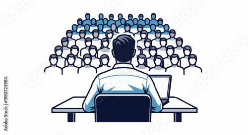 Speaker addressing an audience from behind a table with a laptop