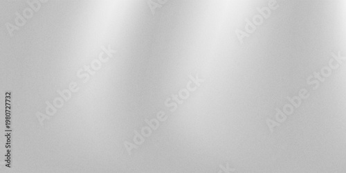 Abstract silvery white light gray gradient background with fine grain texture noise. Often used as a base for displaying logo designs or typography for an elegant and premium look