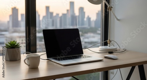 A laptop with a blank screen, a potted plant, a mug, and a lamp on a wooden desk in front of a window with a cityscape view.