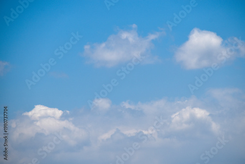 Beautiful clear blue sky with puffy white clouds. Thick cloud cluster. Relaxing view, beautiful day. Good weather condition.