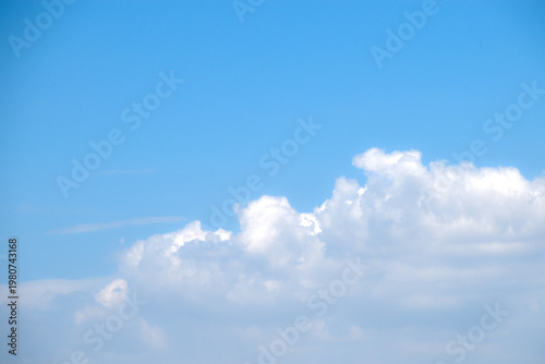 Beautiful clear blue sky with puffy white clouds. Thick cloud cluster. Relaxing view, beautiful day. Good weather condition.