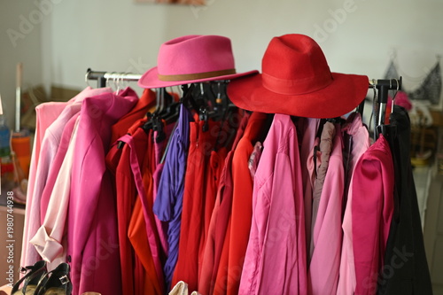 Rack with different stylish women`s clothes 
