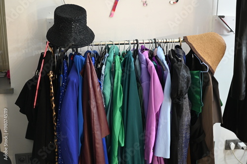 Rack with different stylish women`s clothes 