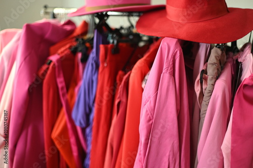 Rack with different stylish women`s clothes 