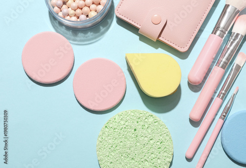 Foto Set of makeup products on a blue background
