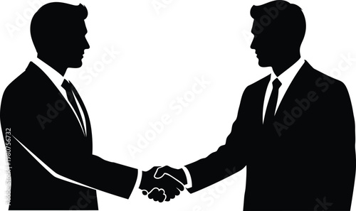 Business partnership silhouette of two men shaking hands