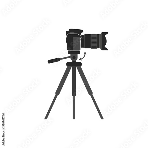 Black DSLR camera on tripod stand.