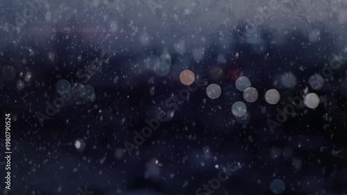 Snowfall at Night Through Window with Blurred City Lights Background