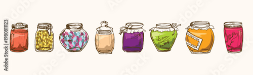 Collection of assorted glass jars filled with colorful jams and preserves.